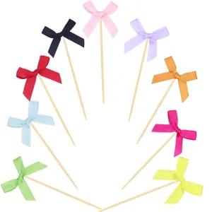Colorful ribbon bow cupcake toppers set, fabric bows with wooden sticks for party cake decoration.