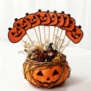 Halloween pumpkin cake topper set with witch figurine and dried flowers for baking decor.