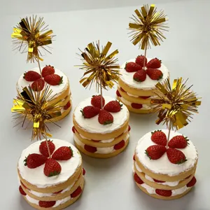Decorative gold tinsel fireworks cake toppers for festive party and birthday dessert decor.