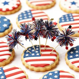 Detailed view of US Independence Day theme firecracker picks and American flag cookies.