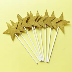 Gold glitter star cake toppers for party decoration, dessert inserts with white sticks.