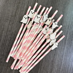 Halloween pink striped paper straws with cute ghost cutouts for party dessert decor.