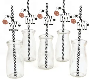 Detail shot of cute zebra cartoon straws with glass bottles for party decoration.