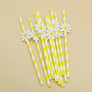 Yellow and white striped paper straws with cute daisy flower decorations for parties.
