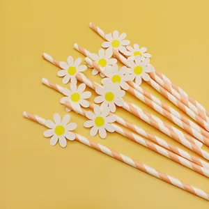 Charming pink striped paper drinking straws featuring cute daisy flower cutouts for parties.