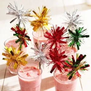 Colorful tinsel firework picks detail shot, perfect for festive cake and dessert decorations.