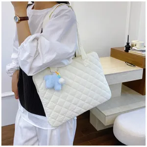 Korean style quilted laptop bag detail view featuring soft texture and star pendant.