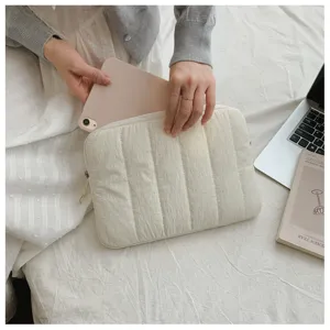 Detail view of the minimalist quilted laptop sleeve and tablet storage case compartment.