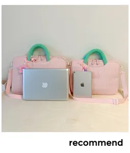 Pink textured laptop tote bag with green handles large capacity daily commuting style.