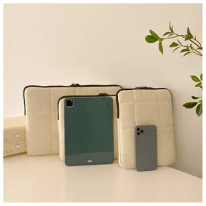 Korean style quilted laptop sleeve detail view, minimalist solid color down storage bag.