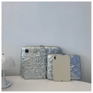 Silver quilted bow laptop sleeve, lightweight protective storage bag for student daily use.