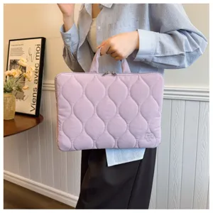 Lightweight purple quilted laptop bag with handles, stylish sleeve case for daily commute.