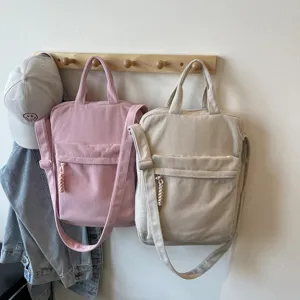 Minimalist corduroy laptop shoulder bag, large capacity casual tote backpack for daily use.