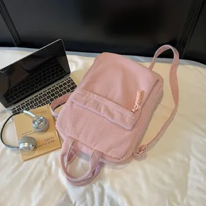 Pink corduroy backpack for women, large capacity laptop school bag, simple travel rucksack.