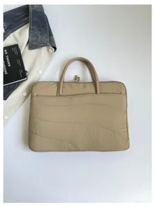 Detailed view of the Korean style quilted laptop sleeve bag in beige, showing texture.
