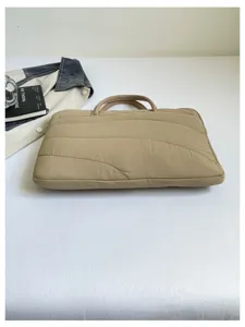 Quilted beige laptop sleeve, 14 inch slim protective bag for daily commuting and office use.