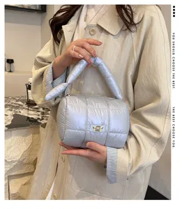 Cute puffy cosmetic handbag with quilted cylinder design, lightweight portable travel wash bag.