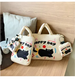 Detailed view of cute black cat laptop sleeve set, aesthetic canvas bag with matching pouch.