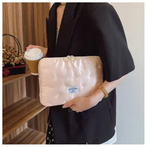 Pink embroidered bow laptop sleeve 14 inch, portable quilted padded notebook case detail view