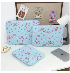 Quilted laptop sleeve set with cute pink bow and star embroidery, spacious storage bag.