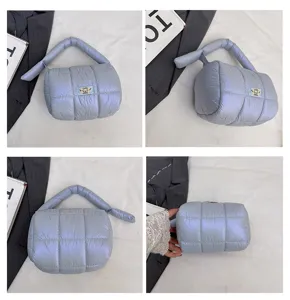 Stylish quilted puffy handbag and lightweight cosmetic pouch with unique knot handle design for travel.