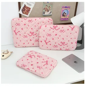 Pink quilted laptop sleeve with cute embroidered bow and star pattern, tablet bag.