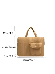 Quilted laptop bag with handle and front pocket, stylish and durable storage solution.