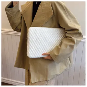 White quilted laptop sleeve detail shot, soft padded tablet case for daily storage and protection.