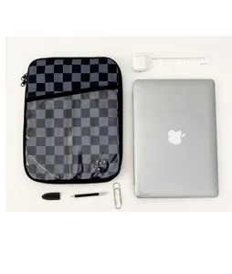 Detailed view of black grey checkered tablet sleeve with plush lining and transparent front pocket.