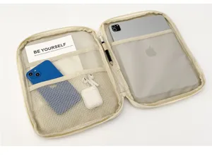 Beige tablet storage sleeve organizer case with multi-pocket interior compartments.