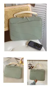 Green laptop sleeve with beige handle, shockproof protective bag for tablet and computer.