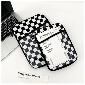 Black and white checkered laptop sleeve plush padded ipad protective bag detail view.