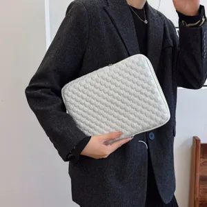 Minimalist puffy laptop sleeve, soft quilted tablet bag, stylish protective case for daily use.