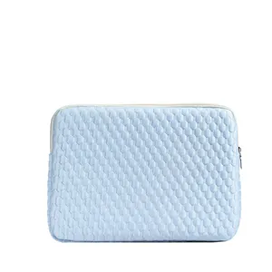 Minimalist light blue quilted laptop sleeve and tablet storage protective inner bag.