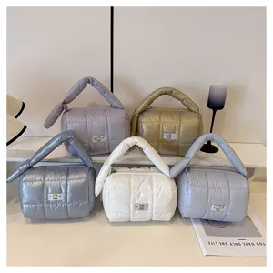 Puffer handbag and cute cosmetic storage pouch, lightweight travel toiletry bag style.