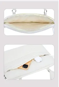 Detailed view of white quilted padded laptop cloud bag interior and front zipper pocket storage.