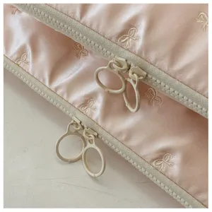 Pink bow embroidered laptop sleeve 14 inch, portable waterproof protective detail.