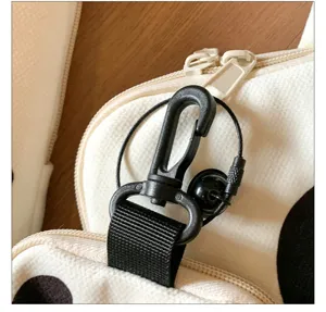 Close-up detail of cute laptop sleeve hardware, durable black hook and smooth double zippers.