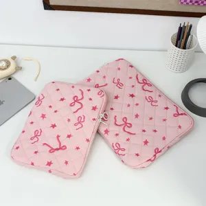 Cute pink quilted laptop sleeve with embroidered bows and stars, perfect for daily use and travel storage.