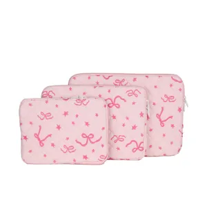 Pink quilted laptop sleeve set with cute embroidered bows and stars, soft tablet storage bag.