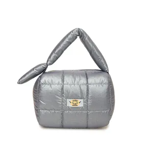 Quilted puffer cosmetic bag with soft metallic finish, portable travel toiletry pouch.