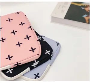 Cute floral laptop sleeve for iPad and Macbook, protective case with zipper and soft interior.