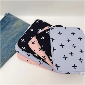 Close-up view of cute floral pattern laptop sleeve inner bag, featuring soft quilted padded design.