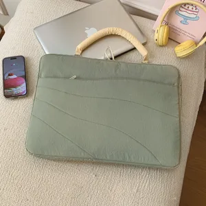 Green quilted laptop sleeve with handle, shockproof protective case for tablet and notebook.