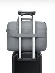 Minimalist grey business 16-inch laptop bag with trolley strap for daily commute.