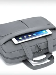 Minimalist gray business laptop bag with front pocket and handles, perfect for daily commute.