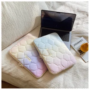 Detailed shot of quilted gradient laptop sleeve, soft padded inner case for tablet and notebook.