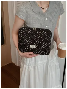 Detailed view of Korean floral quilted 13 inch laptop sleeve and tablet storage bag.