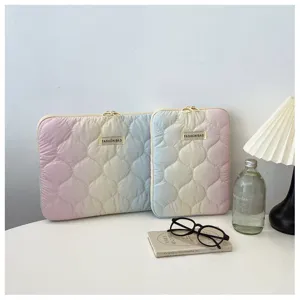 Detailed view of cute gradient tie-dye quilted laptop sleeve for tablet and computer.
