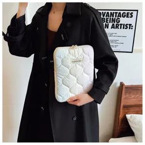 Detailed view of the cute quilted gradient laptop sleeve featuring soft padding and secure zip.